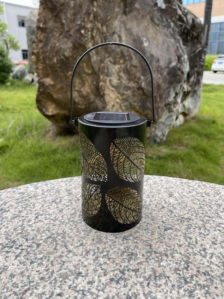 Cylinder-Shape LED Solar Metal Lantern Leaves Patterns Hollow Carved with Handle