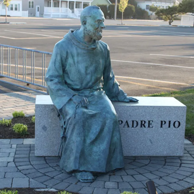 Padre Pio Statue Sitting on Stone Bench Bronze Sculpture